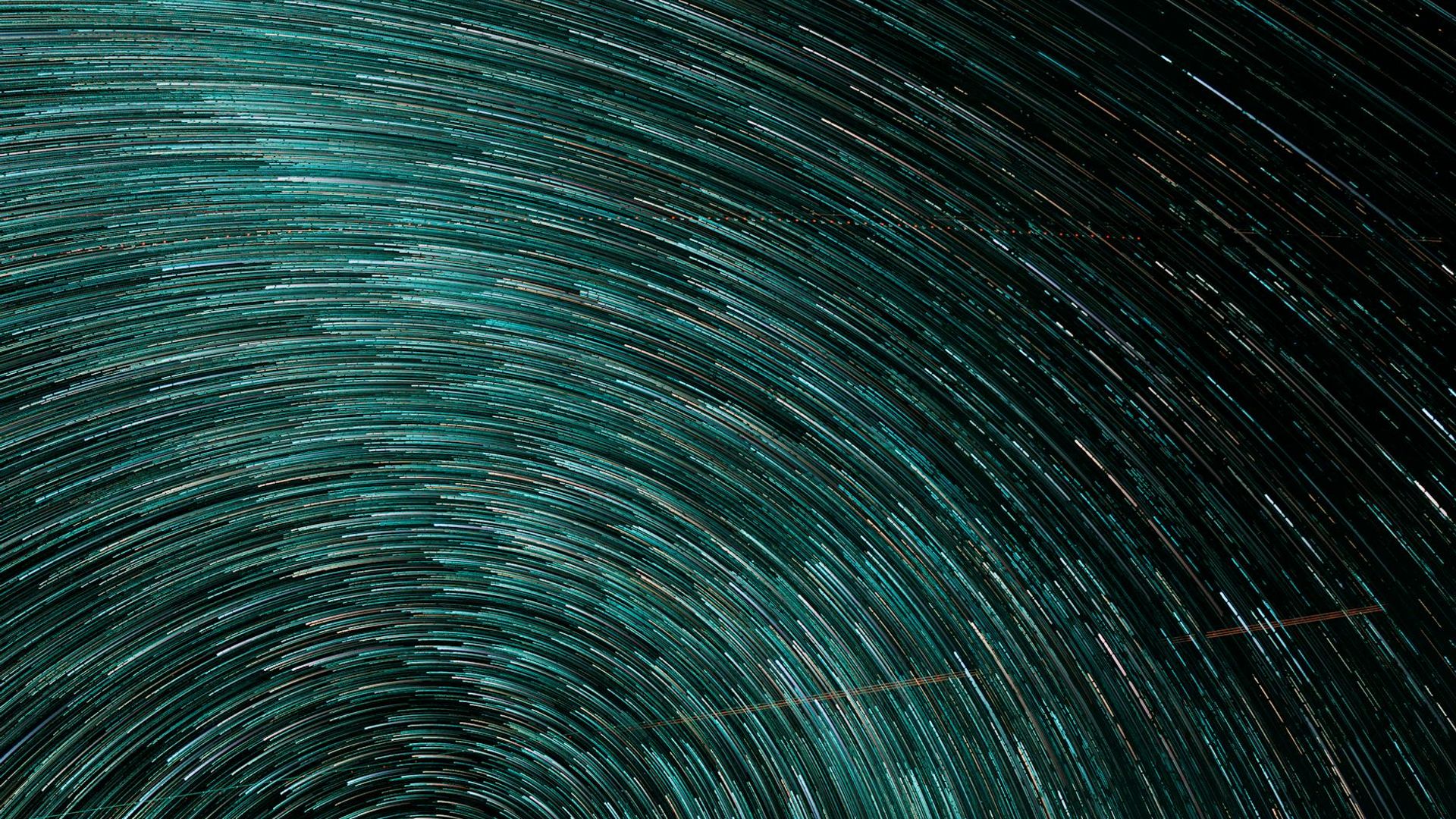 Abstract dark background suggesting movement and space.